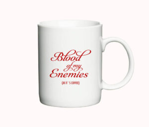 Hvid kaffekop med sjov tekst "Blood of my Enemies (JK it's coffee)" i rød skrift, ideel som gave til kaffeelskere med humor.
