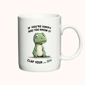 Hvidt krus med en tegning af en T-Rex og teksten "If You're Happy and You Know It, Clap Your... Oh!"