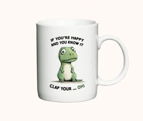 Hvidt krus med en tegning af en T-Rex og teksten "If You're Happy and You Know It, Clap Your... Oh!"