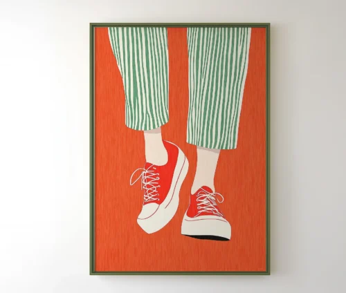 Indrammet plakat med sneakers og grafisk design i rød, grøn og orange farvepalet.