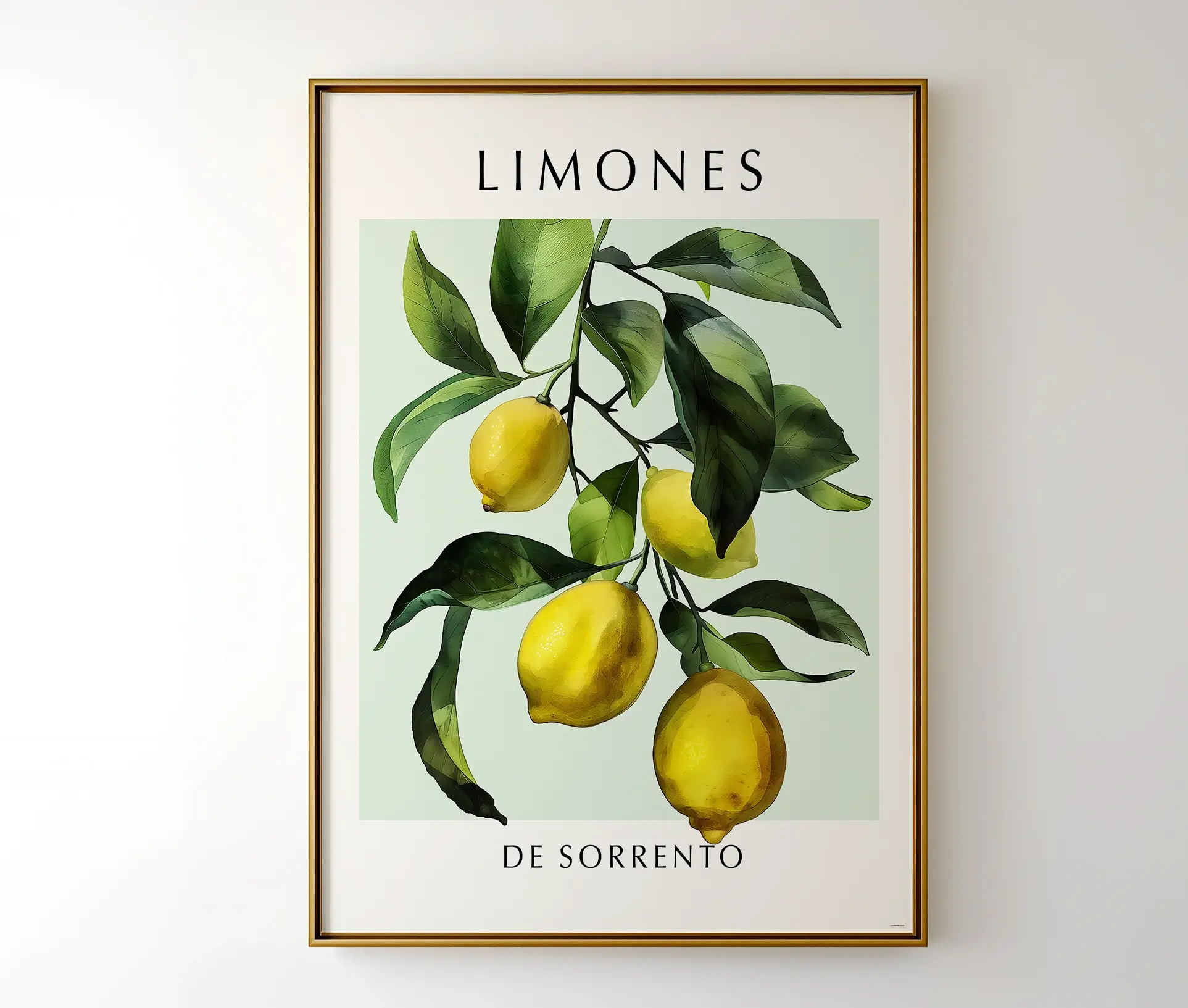 Citrusplakat med citroner fra Sorrento, indrammet i en gylden ramme og hængt på en hvid væg.