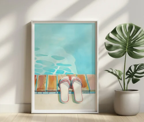 Plakat med sommermotiv lænet mod væggen i et lyst rum.