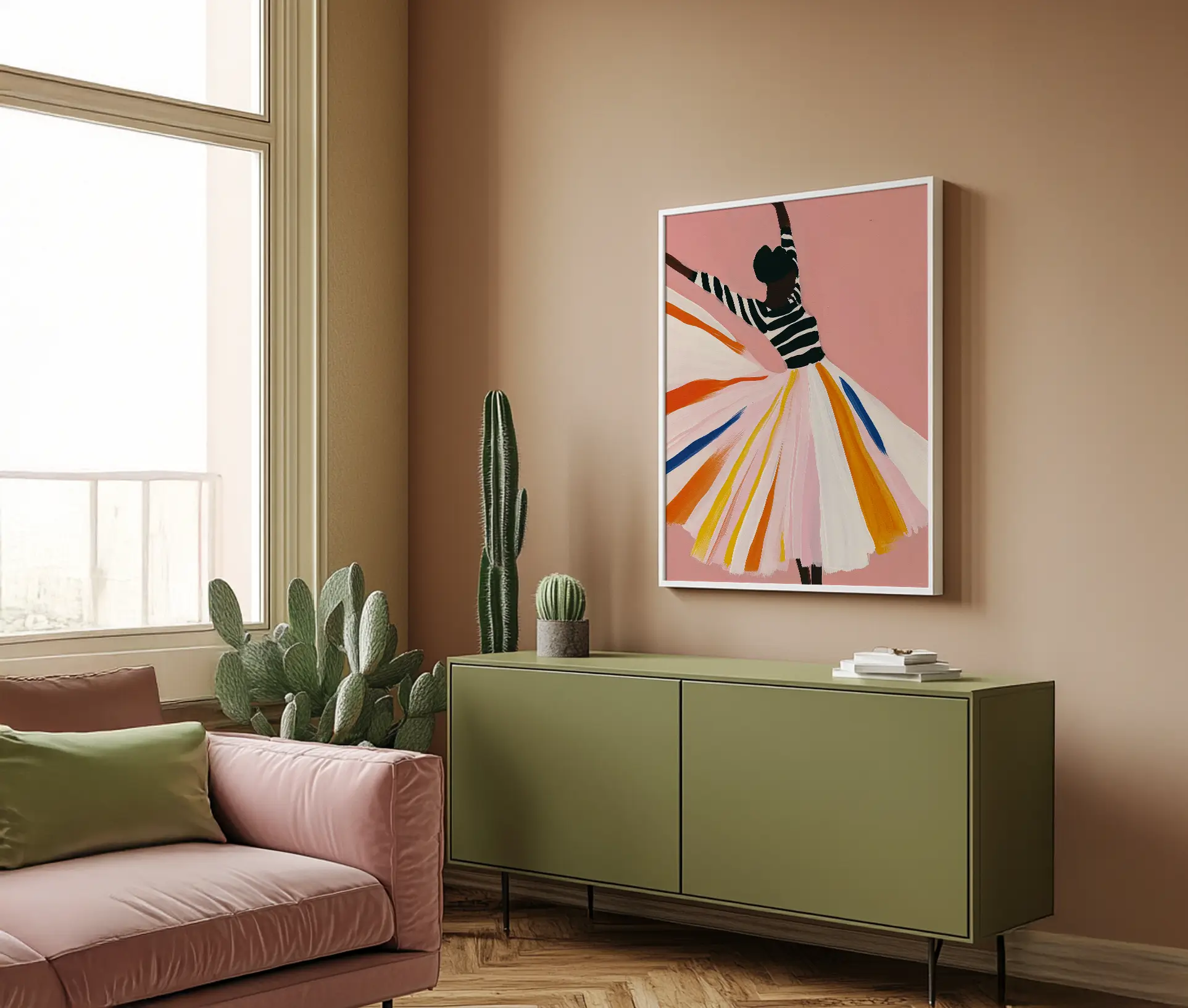 Plakat med dansende kvinde ophængt over grøn skænk i stue med rosa sofa.