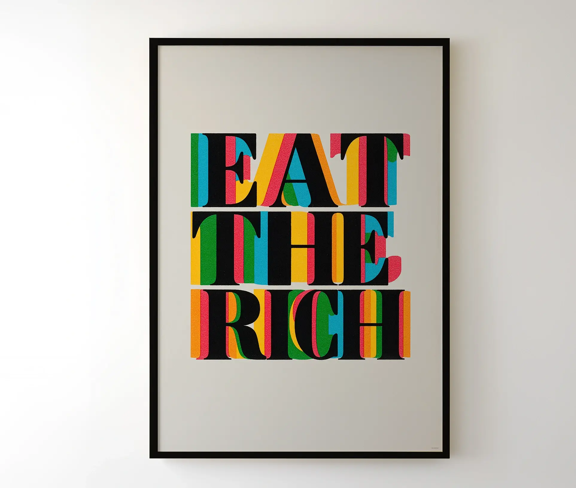 Indrammet “Eat the Rich”-plakat hængende på væg