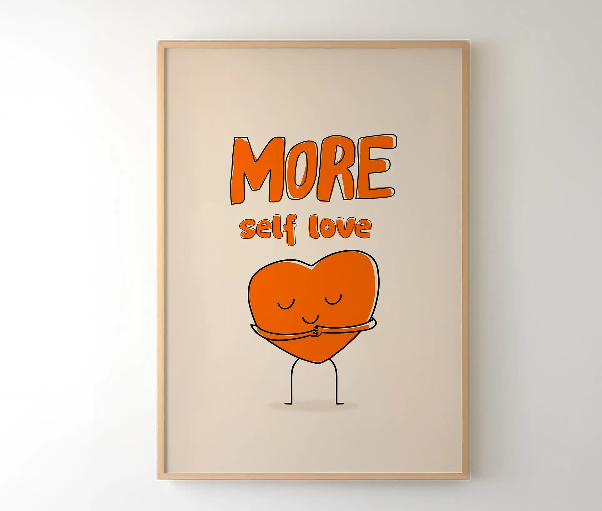Plakat med orange hjerte, der krammer sig selv og teksten "More self love" vist i træramme
